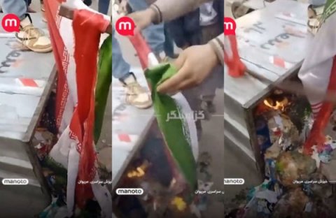 Etirazçılar İran bayrağını zibil qutusuna atıb yandırdılar